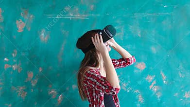 Happy young woman with virtual reality headset