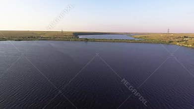 Flying over the big river. Aerial view from copter.