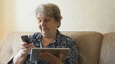 Old woman talking on a mobile phone
