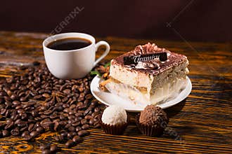 Truffles, Tiramisu and Black Coffee on Wood Table