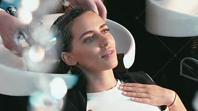 Girl in a beauty salon wash the head