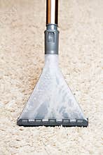 Cleaning carpet by washing hoover