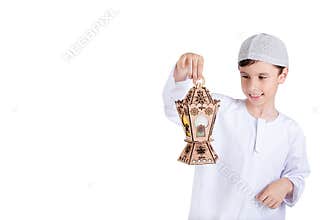 Ramadan Kareem - Happy young kid playing with Ramadan lantern