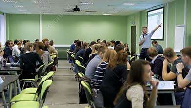 Practical seminar in audience of college. Students have gathered for a lecture to the teacher of economy.