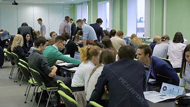 The audience in an office building. Team building. Formation and development of teamwork skills. With the help of the