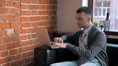 Young Entrepreneur Freelancer Working using a Laptop and in Coworking