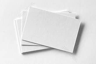 Mockup of business cards fan stack at white textured paper