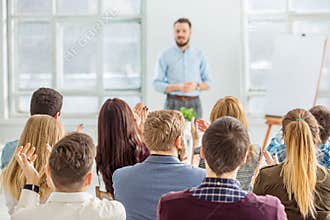 Speaker at Business Meeting in the conference hall.