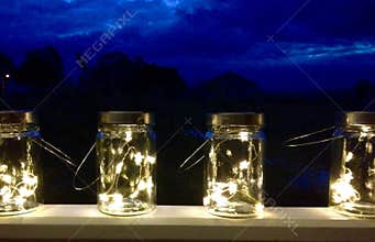 Fairy lights inside retro vintage top jars with handles