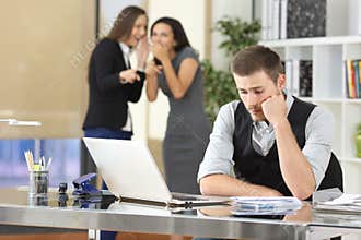 Workers bullying a colleague at office