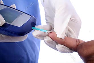 Nurse and a Diabetic Finger Stick
