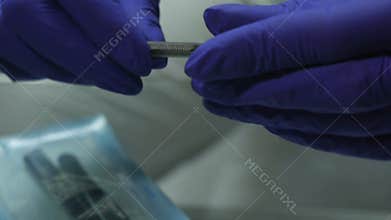 Dentist unpacks sterile dental instruments