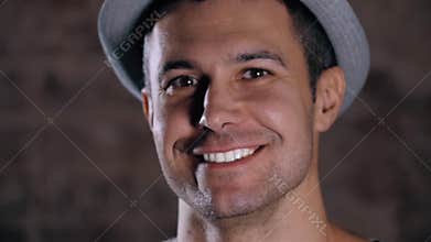 Handsome mature man smiling with perfect white teeth with hat, happy portrait
