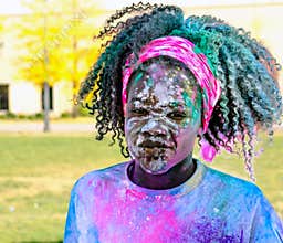 Young girl covered in color at the color run