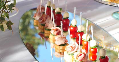 Beautifully decorated catering banquet table with different food snacks and appetizers on corporate christmas birthday