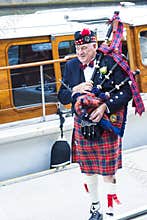 Scottish man with bagpipes and kilt