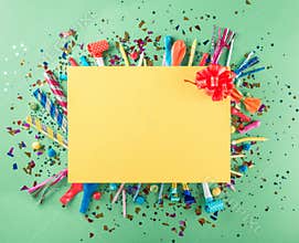 Big card with party confetti, balloons, streamers, noisemakers a