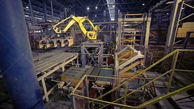 Industrial robot. Robotic arm assembling products on a modern plant.