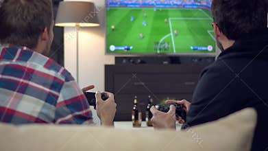 Friends playing football on video game console