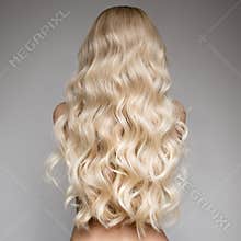 Beautiful Young Blond Woman With Long Wavy Hair.