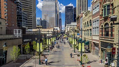 Pedestrians walking along Stephen Avenue