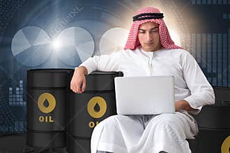 The arab businessman trading crude oil on laptop