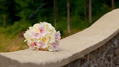 A Wedding Bouquet on a Stone Wall