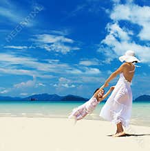 Woman and girl on the beach