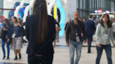 Anonymous crowd of walking businesspeople