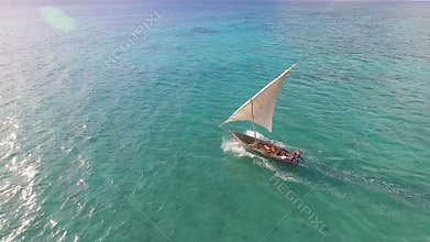 Aerial view of fishermen go out on sailboats to the ocean for fishing. Zanzibar.