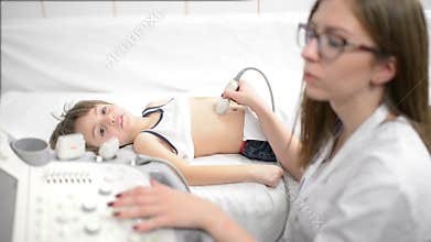 Cute Boy Being Scanned with Ultrasound Device