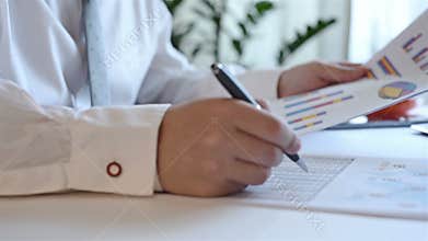 Businessman Working With Business Report