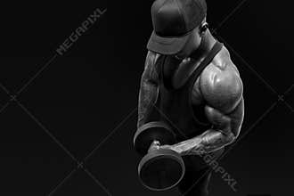 Muscular bodybuilder wearing a tank top and black cap doing bic