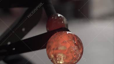 Glass workshop. Blowing glass products, the process of manufacturing the product, close up