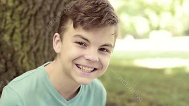 Teen boy in city park