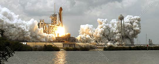 Space shuttle taking off