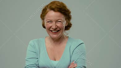 Mid aged actress showing different emotions and smiling.