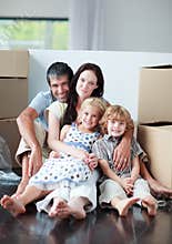 Family lying on the floor after buying a house