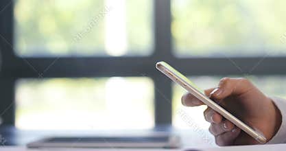 Close up of a woman using mobile smart phone with one hand shot for graphics