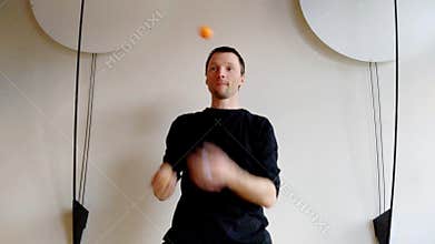Speedup juggler. Funny show with juggling man
