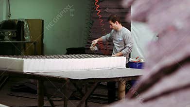 Worker manufacturing mattress