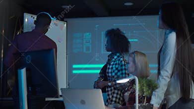 Designers having meeting neat whiteboard