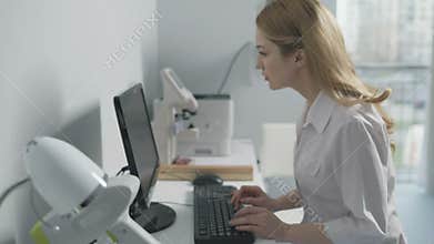 Female medical doctor working on computer