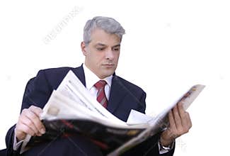 Businessman reading newspaper