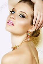 Blond woman with necklace and smile