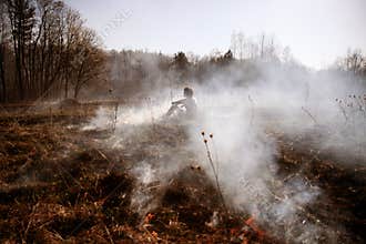Wildfire. Fire. Global warming, environmental catastrophe. Concept man helpless before a natural disaster. Protection