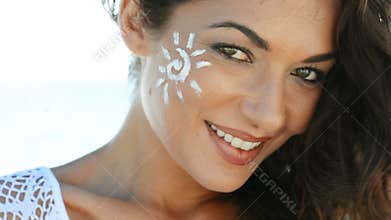 Smiling Girl With Sun Lotion