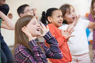 Group Of Children Enjoying Drama Class Together