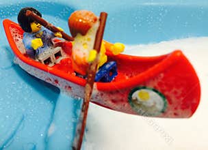 lego figures in canoe