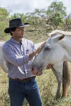 Brazilian cowboy with mare